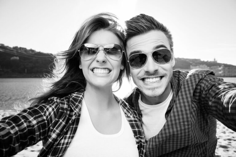 A man and a woman smiling after recently having dental sealants placed at MI Dental, Kitchener